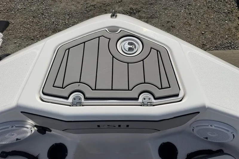 Slide: The Image of 2020 Yamaha Boats 210 FSH Sport bow with storage compartment and speakers. - 8