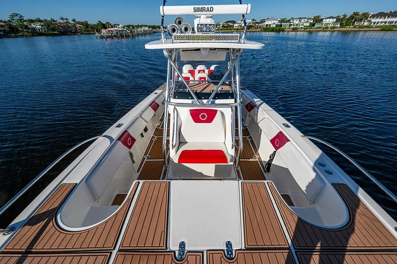 Slide: The Image of 2009 Fountain 38 Center Console boat with sleek design on calm water. - 22