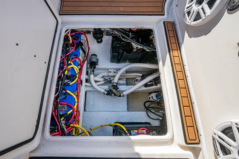 Slide: The Image of 2009 Fountain 38 Center Console boat wiring and battery compartment. - 28