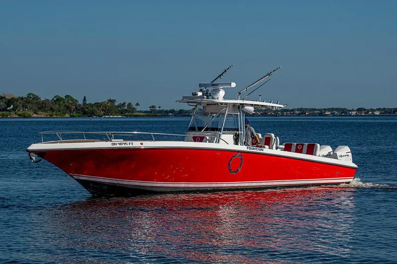 Slide: The Image of 2009 Fountain 38 Center Console boat cruising on a calm blue lake. - 37