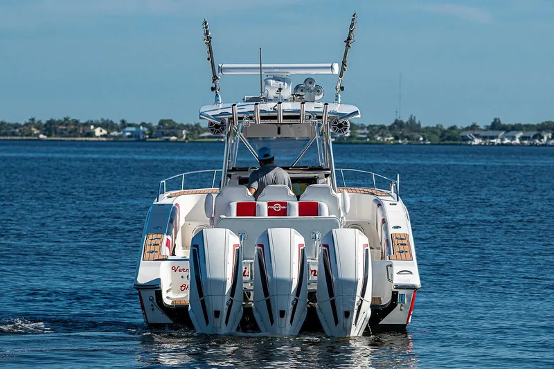Slide: The Image of 2009 Fountain 38 Center Console boat with multiple engines on open water. - 6