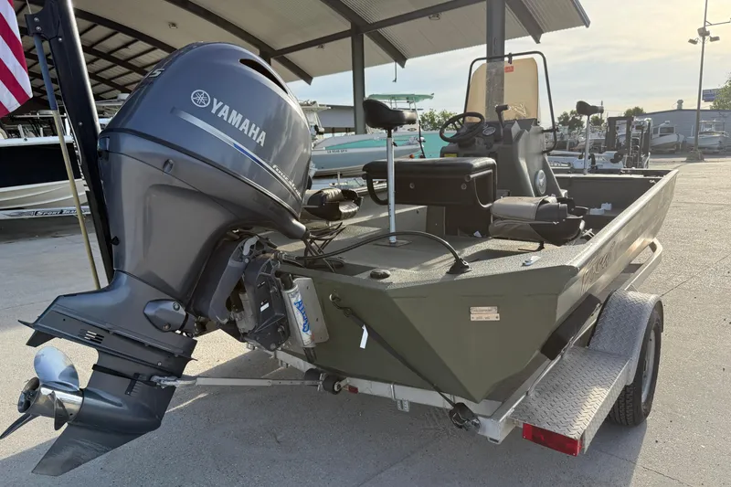 Slide: The Image of 2014 Excel 203 Bay Pro boat with Yamaha outboard motor on trailer. - 4