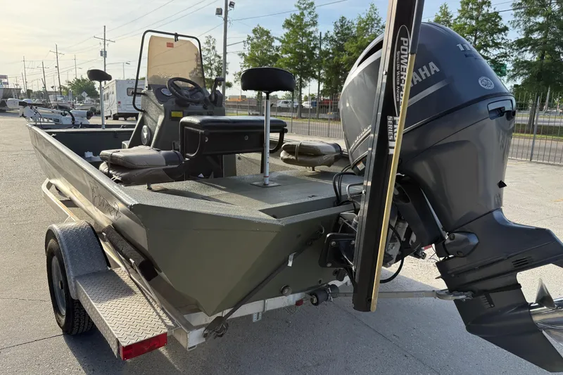 Slide: The Image of 2014 Excel 203 Bay Pro boat with Yamaha outboard motor on trailer. - 5