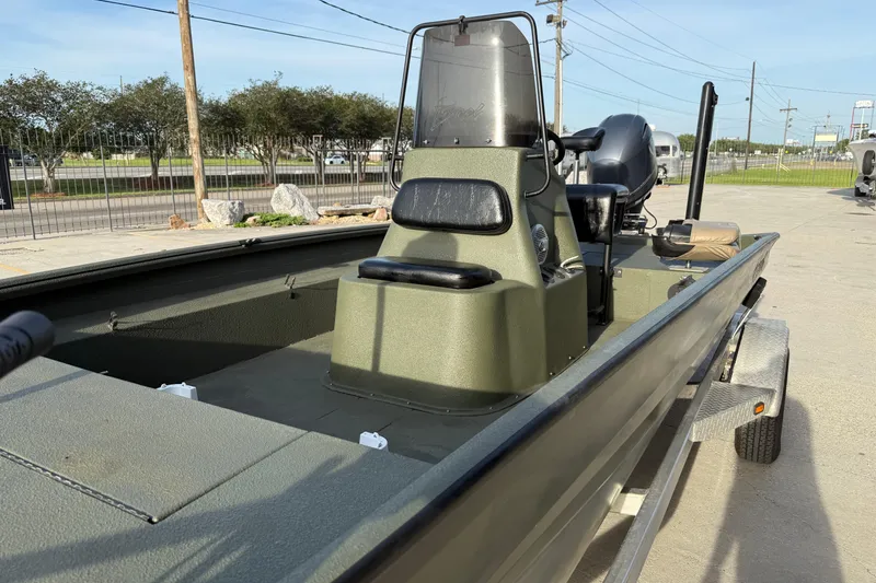Slide: The Image of 2014 Excel 203 Bay Pro boat on trailer, parked outdoors. - 8