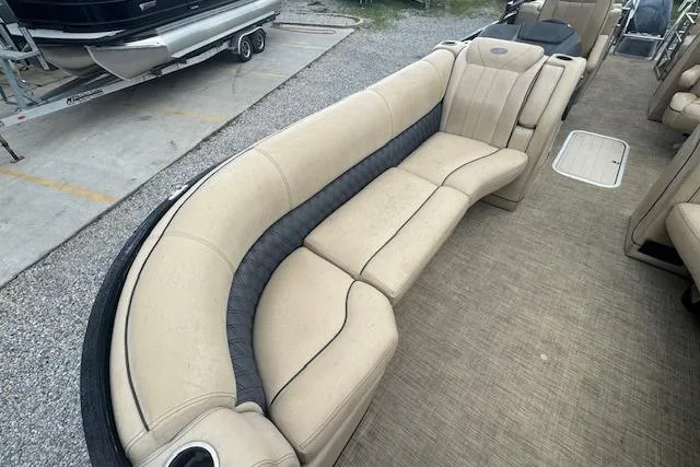Slide: The Image of 2020 Barletta Lusso 25QCSS pontoon boat with beige seating and spacious interior layout. - 13