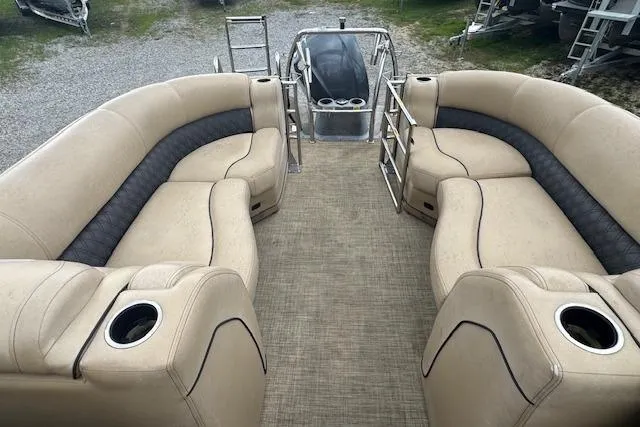 Slide: The Image of 2020 Barletta Lusso 25QCSS pontoon boat interior with beige seating and cup holders. - 17