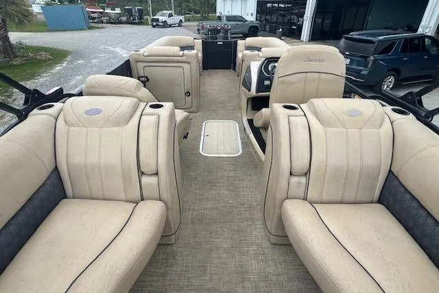 Slide: The Image of 2020 Barletta Lusso 25QCSS pontoon boat interior with luxurious beige seating. - 18
