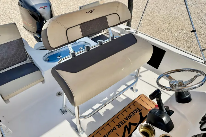 Slide: The Image of 2021 Tidewater 1910 Bay Max boat interior with seating and steering wheel. - 11