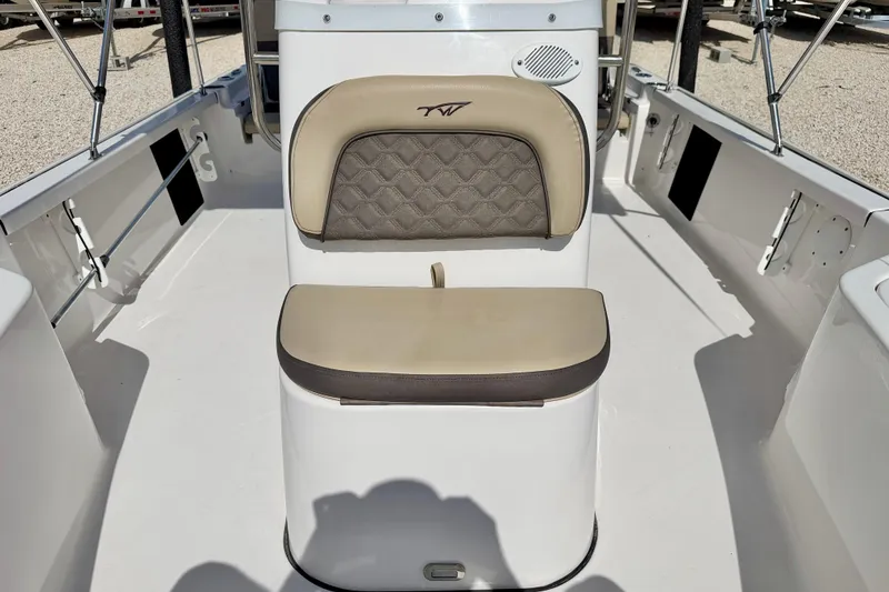 Slide: The Image of 2021 Tidewater 1910 Bay Max boat interior with cushioned seating and sleek design. - 19