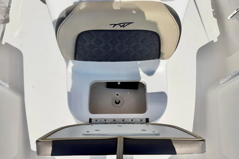Slide: The Image of Tidewater 1910 Bay Max 2021 boat seat with storage compartment, featuring beige and black upholstery. - 20