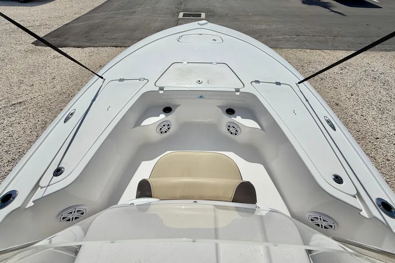 Slide: The Image of 2021 Tidewater 1910 Bay Max boat interior with seating and storage compartments. - 21