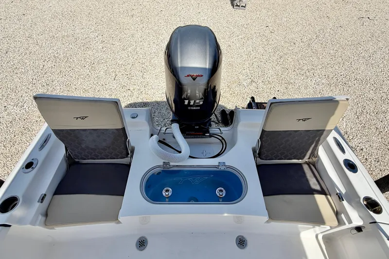 Slide: The Image of 2021 Tidewater 1910 Bay Max boat with Yamaha 115 engine, featuring seating and storage. - 25