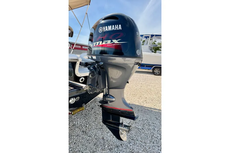 Slide: The Image of Yamaha VMAX outboard motor on 2021 Tidewater 1910 Bay Max boat, parked on gravel. - 26