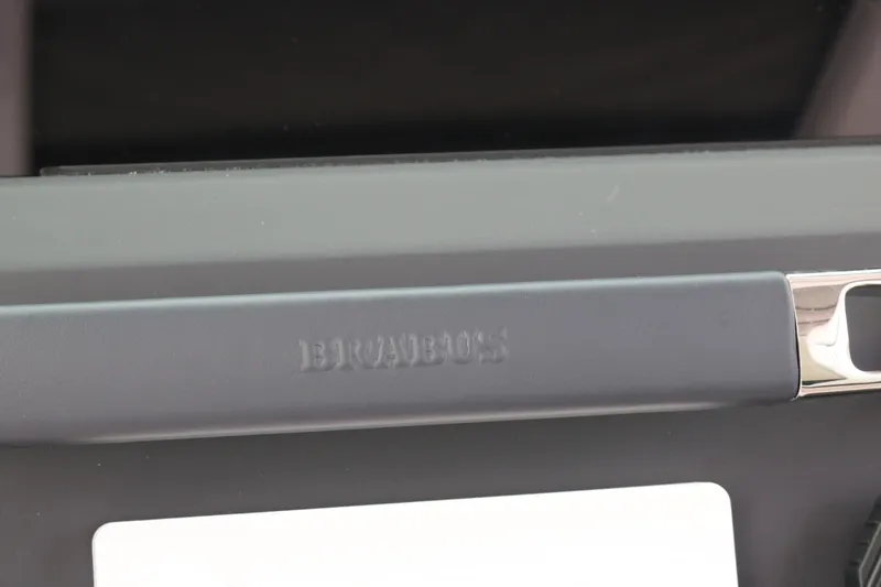 Slide: The Image of Close-up of a Brabus-branded handle on a 2026 Axopar 29 Sun-Top boat. - 19