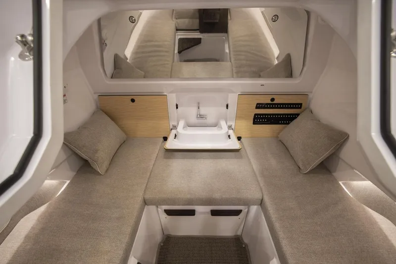 Slide: The Image of Luxurious interior of 2026 Axopar 29 Sun-Top boat with cozy seating and modern amenities. - 6