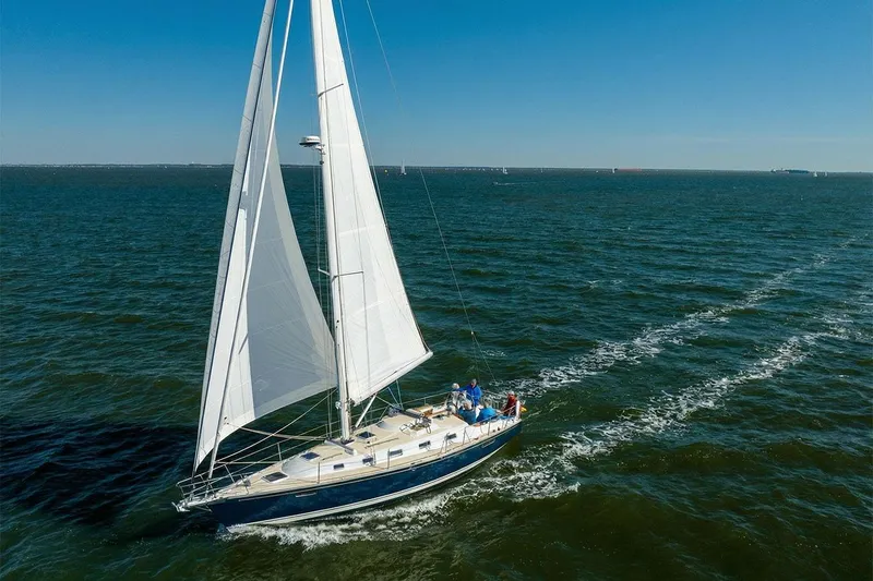 The Image of Sailing yacht Tartan 365, 2022 model, cruising on open sea under clear blue sky. - 0