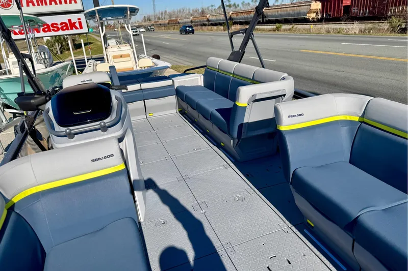 Slide: The Image of 2025 Sea-Doo Switch Cruise Limited 21 pontoon boat interior with spacious seating and modern design. - 14
