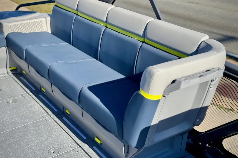 Slide: The Image of 2025 Sea-Doo Switch Cruise Limited 21 boat seating, featuring blue and gray cushioned seats. - 3