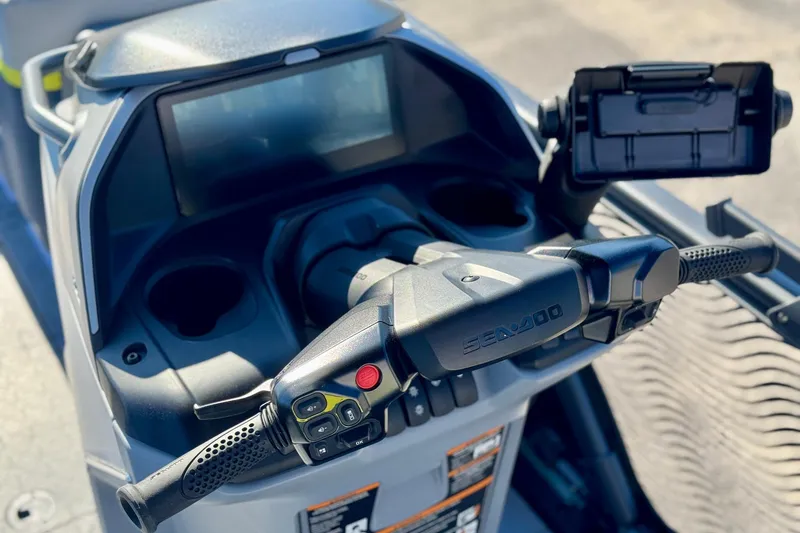 Slide: The Image of 2025 Sea-Doo Switch Cruise Limited 21 dashboard with controls and smartphone holder. - 6