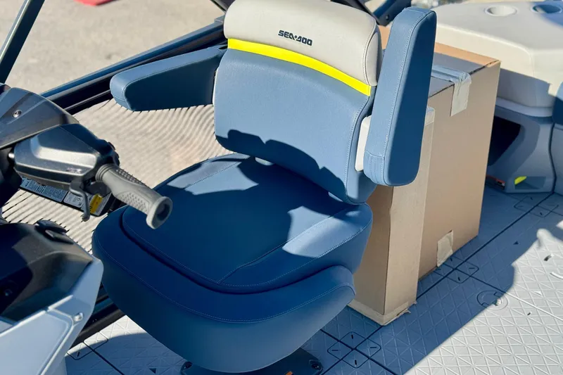 Slide: The Image of 2025 Sea-Doo Switch Cruise Limited 21 boat seat with steering controls. - 8