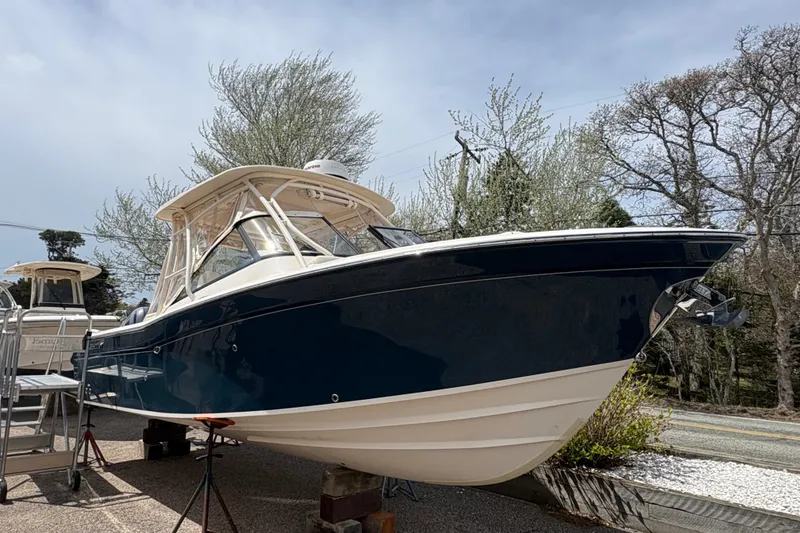 The Image of 2016 Grady-White Freedom 275 boat on display, featuring sleek design and sturdy build. - 0