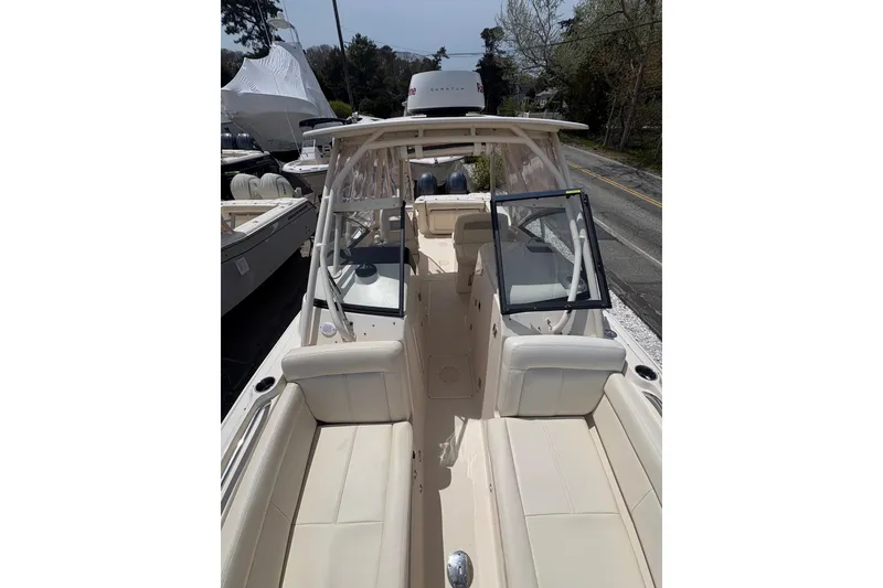 Slide: The Image of 2016 Grady-White Freedom 275 boat with spacious seating and sleek design. - 5