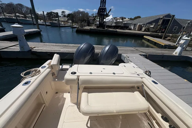 Slide: The Image of 2016 Grady-White Freedom 275 boat docked at marina with dual engines. - 7