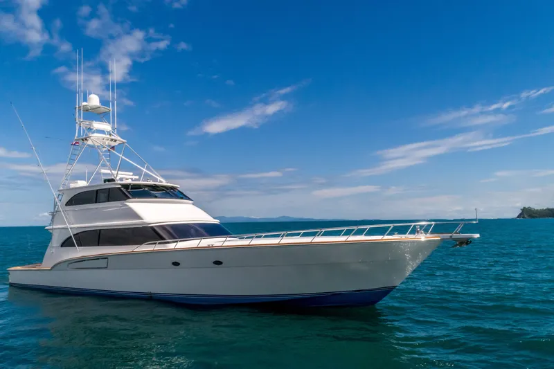 The Image of 2001 Donzi yacht cruising on clear blue ocean under a bright sky. - 0
