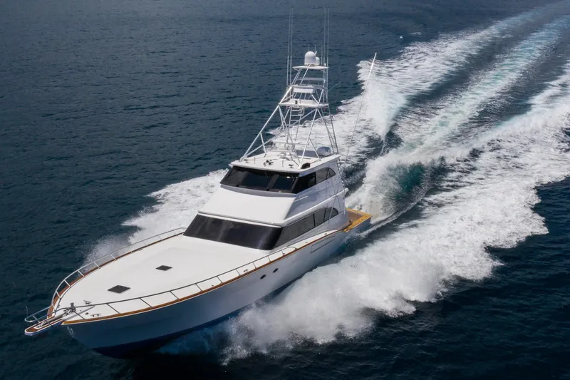 Slide: The Image of 2001 Donzi yacht cruising swiftly on open ocean waters. - 10