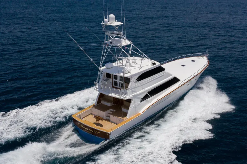 Slide: The Image of 2001 Donzi yacht cruising on open ocean, showcasing sleek design and powerful performance. - 12