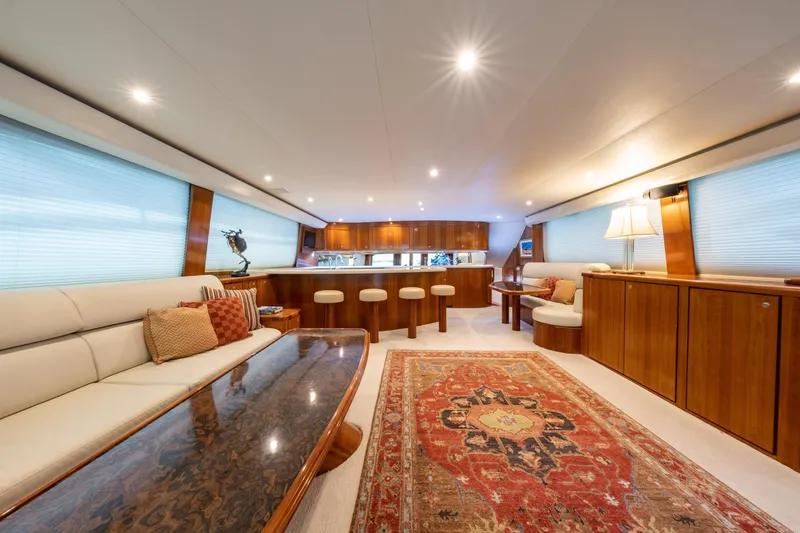 Slide: The Image of Luxurious 2001 Donzi yacht interior with elegant wood finishes and plush seating. - 13