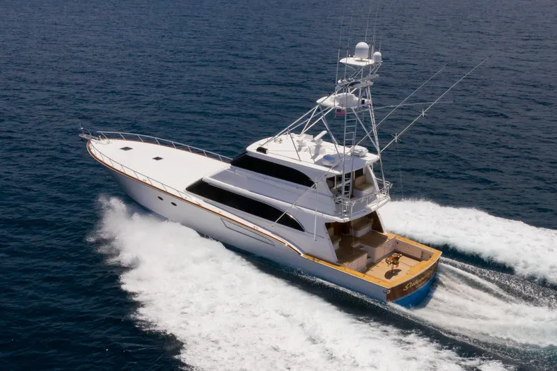 Slide: The Image of 2001 Donzi yacht cruising on open sea, showcasing sleek design and powerful performance. - 14