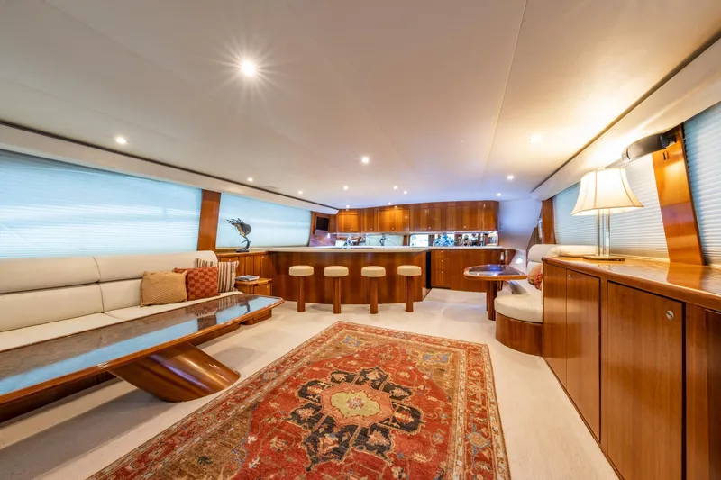 Slide: The Image of Luxurious 2001 Donzi yacht interior with elegant wood finishes and plush seating. - 18