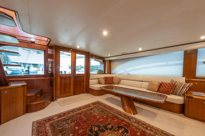 Slide: The Image of Luxurious 2001 Donzi yacht interior with elegant wood finishes and plush seating. - 20