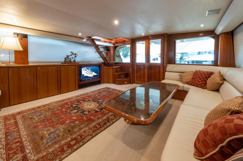 Slide: The Image of Luxurious 2001 Donzi yacht interior with elegant wood finishes and plush seating. - 21