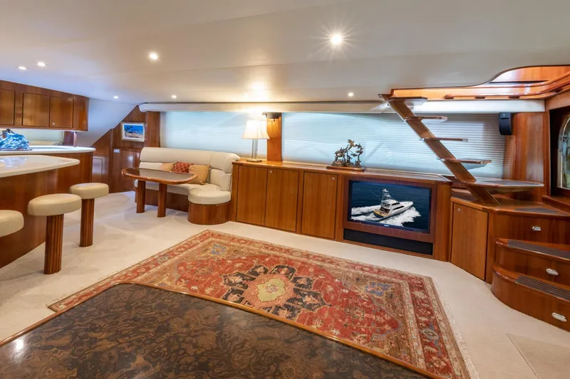 Slide: The Image of Luxurious 2001 Donzi yacht interior with elegant wood finishes and plush seating. - 22
