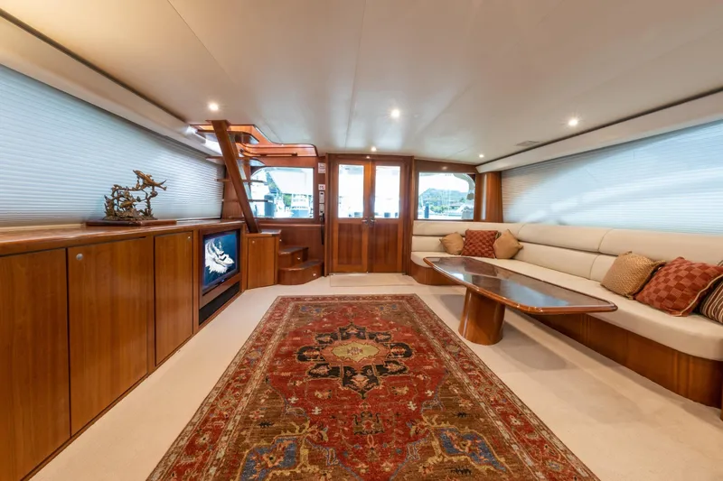 Slide: The Image of Luxurious 2001 Donzi yacht interior with elegant wood finishes and plush seating. - 23