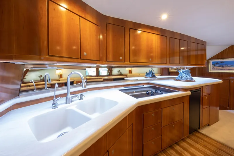 Slide: The Image of Luxurious 2001 Donzi yacht kitchen with wooden cabinets and modern appliances. - 29