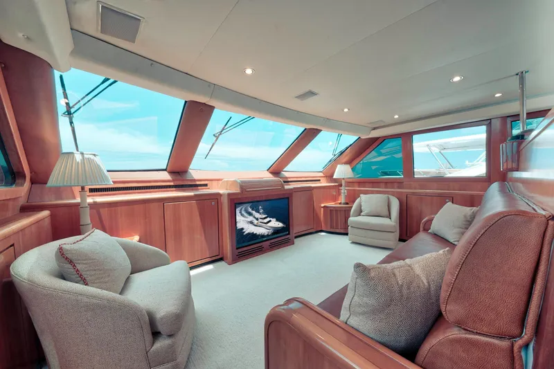 Slide: The Image of Luxurious 2001 Donzi yacht interior with plush seating, large windows, and elegant wood finishes. - 31