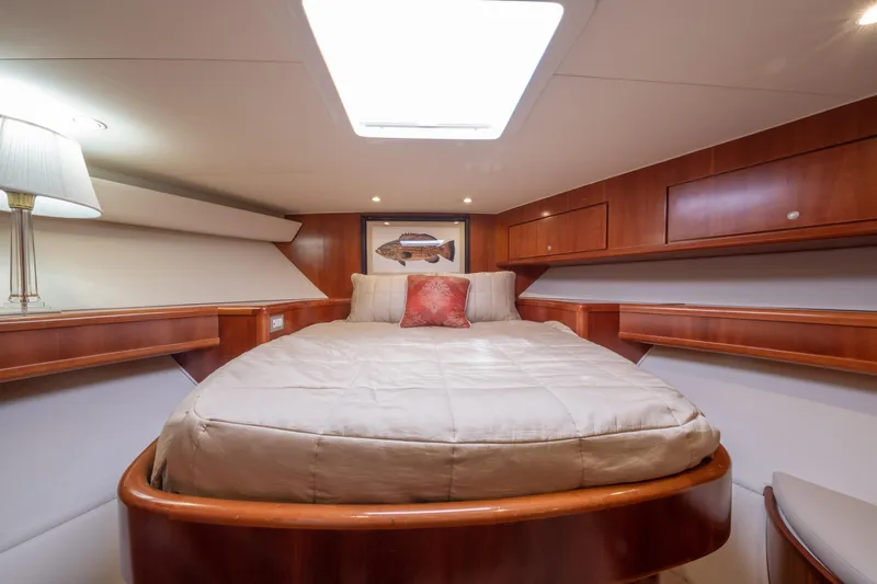 Slide: The Image of Luxurious 2001 Donzi boat cabin with cozy bed and elegant wood finish. - 37