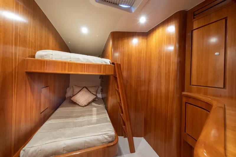 Slide: The Image of Luxurious wooden interior of a 2001 Donzi boat cabin with bunk beds. - 39