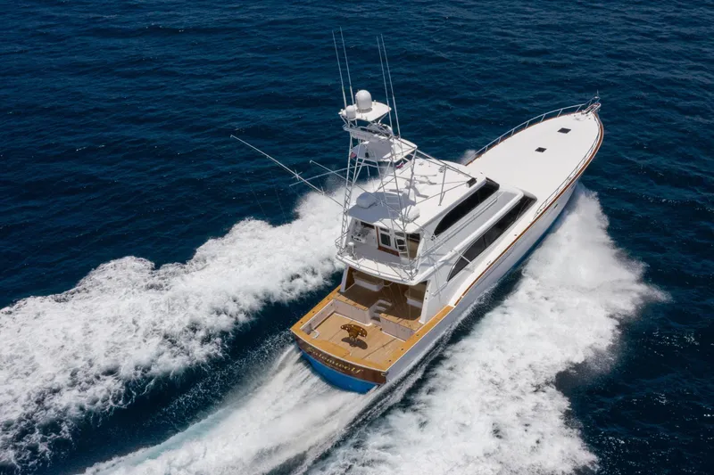 Slide: The Image of Aerial view of a 2001 Donzi yacht cruising through the ocean waves. - 4
