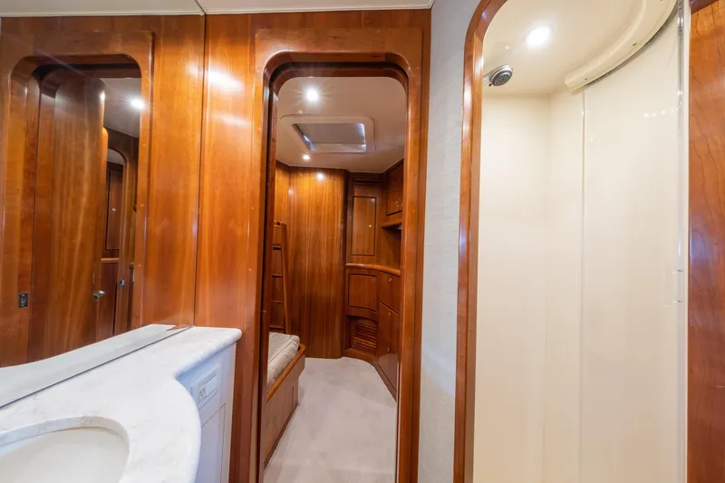 Slide: The Image of Luxurious wooden interior of a 2001 Donzi yacht with modern amenities. - 42