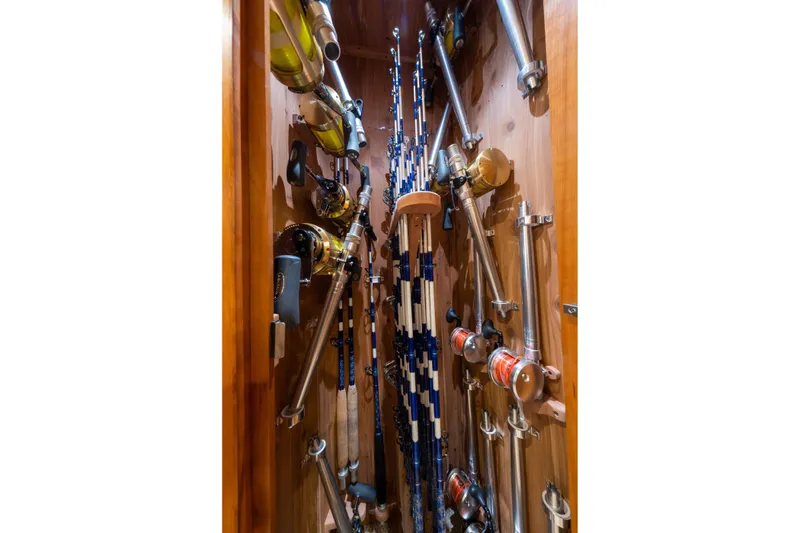 Slide: The Image of Storage of fishing rods and reels inside a 2001 Donzi boat. - 43