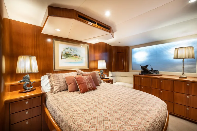 Slide: The Image of Luxurious 2001 Donzi yacht bedroom with elegant wood paneling and stylish decor. - 46