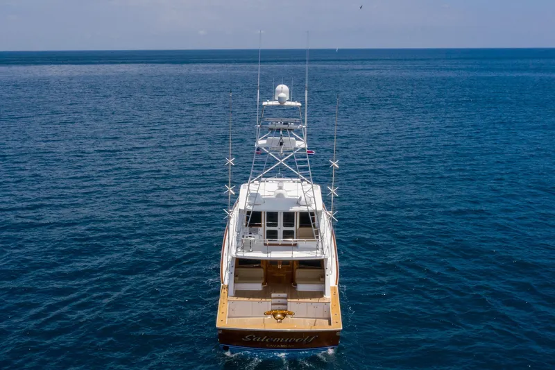 Slide: The Image of 2001 Donzi boat on open sea, viewed from the rear, under clear skies. - 5