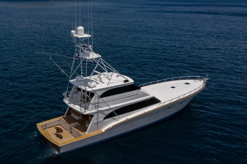 Slide: The Image of 2001 Donzi yacht on open water, featuring a sleek design and spacious deck. - 9