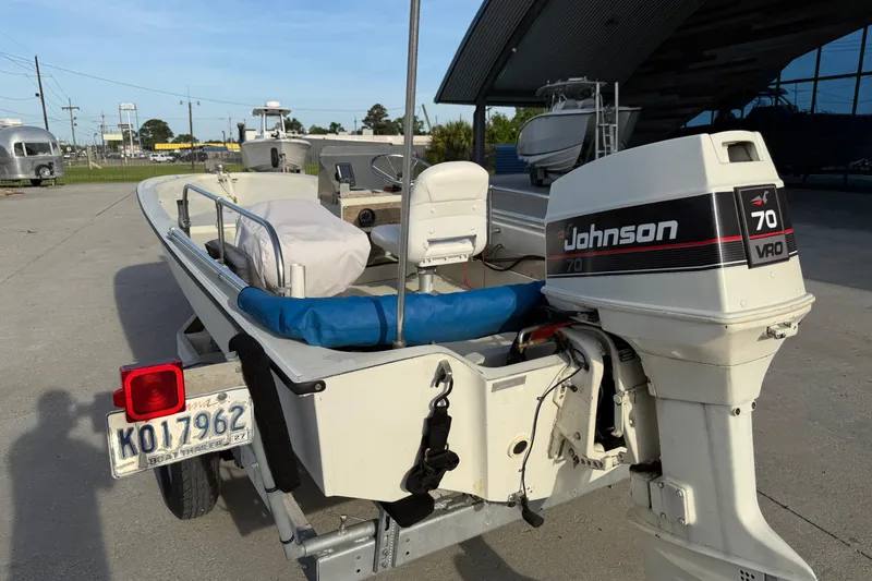 Slide: The Image of 1983 Boston Whaler Sport 15 with Johnson 70 VRO outboard motor on trailer. - 4