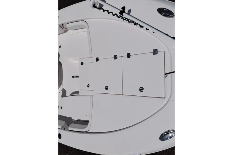 Slide: The Image of 2023 Robalo 246 Cayman boat deck with storage compartments and sleek design. - 11