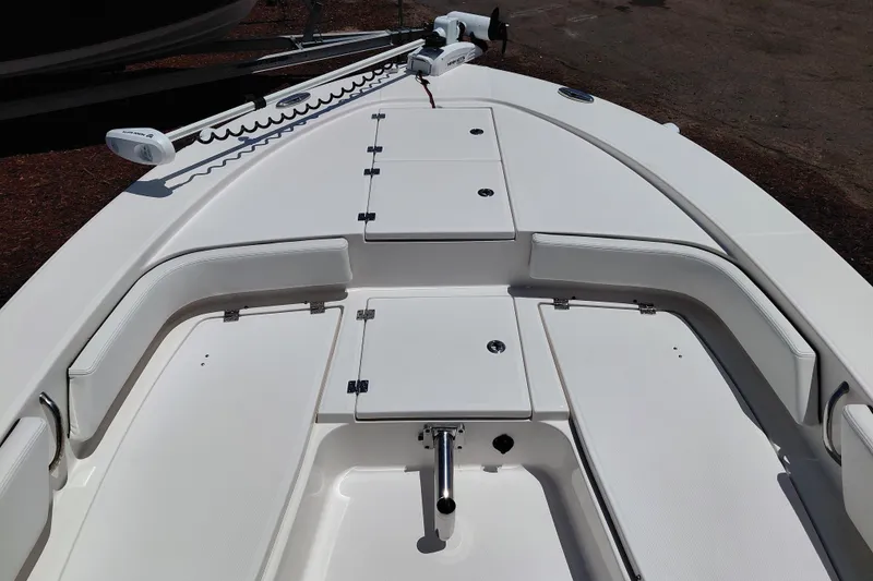 Slide: The Image of 2023 Robalo 246 Cayman boat deck with storage compartments and seating. - 14